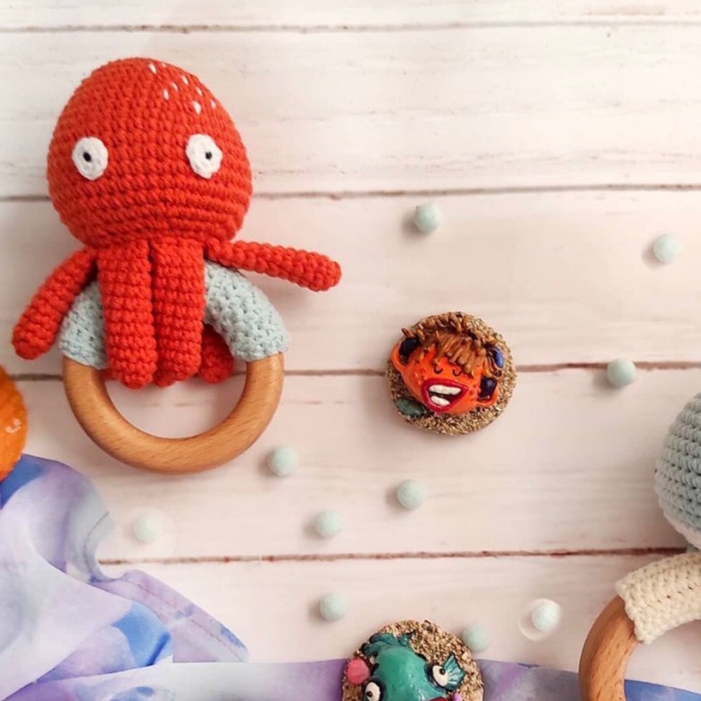 Knit and wood octopus rattle